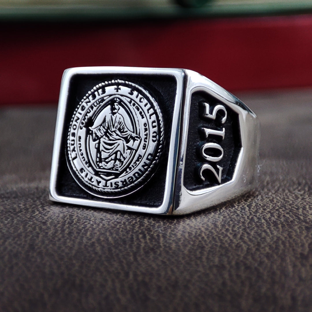 A classic square university ring, crafted in sterling silver and designed for men who take pride in their academic journey. Personalize it with a class year, name, or school emblem to create a one-of-a-kind keepsake. This engraved college signet ring makes a thoughtful graduation or alumni gift, combining sophistication and tradition in a stylish piece of jewelry.