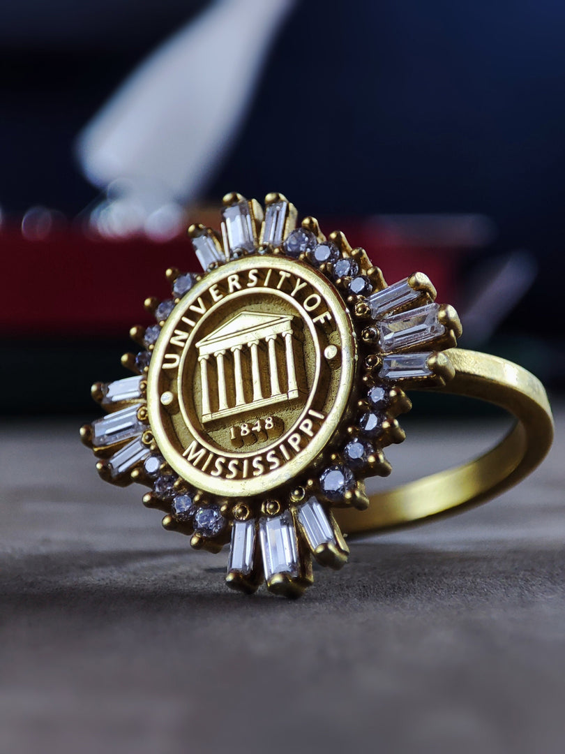 A sophisticated women's university ring, crafted in gold plating for a luxurious finish. Designed as a stylish and elegant class ring, this piece is a perfect graduation gift or alumni keepsake. Whether worn as a symbol of academic success or a daily statement piece, this beautifully crafted college ring is both modern and timeless.