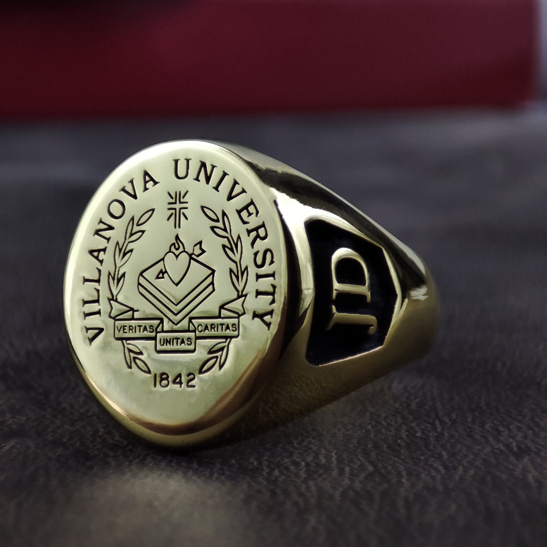 This engraved university ring is a stylish and meaningful graduation gift for students and alumni. Personalize it with a name, class year, or school initials to create a lasting memento. A sleek and elegant signet ring for men and women, this college jewelry piece is a timeless reminder of hard work and academic milestones.
