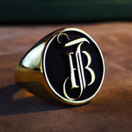 Load image into Gallery viewer, Customizable gold monogram ring featuring two initials in a sleek, minimalist style. Designed for both men and women, this unisex ring offers a stylish way to celebrate relationships or identity. Its adjustable band and polished gold plating make it a standout piece for daily wear or gift-giving.