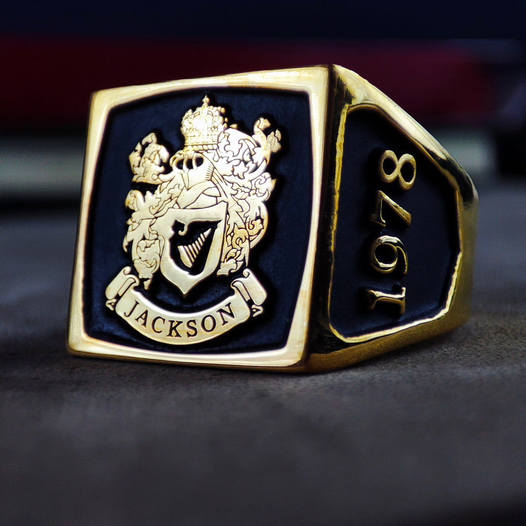 This gold-plated square family crest ring is a bold and elegant accessory, featuring a vibrant enamel inlay and detailed engraving. Designed as a noble heirloom, this custom signet ring is an ideal gift for men who value personal heritage. Whether for formal events or daily wear, this distinguished ring offers a regal and timeless look, symbolizing strength and tradition.