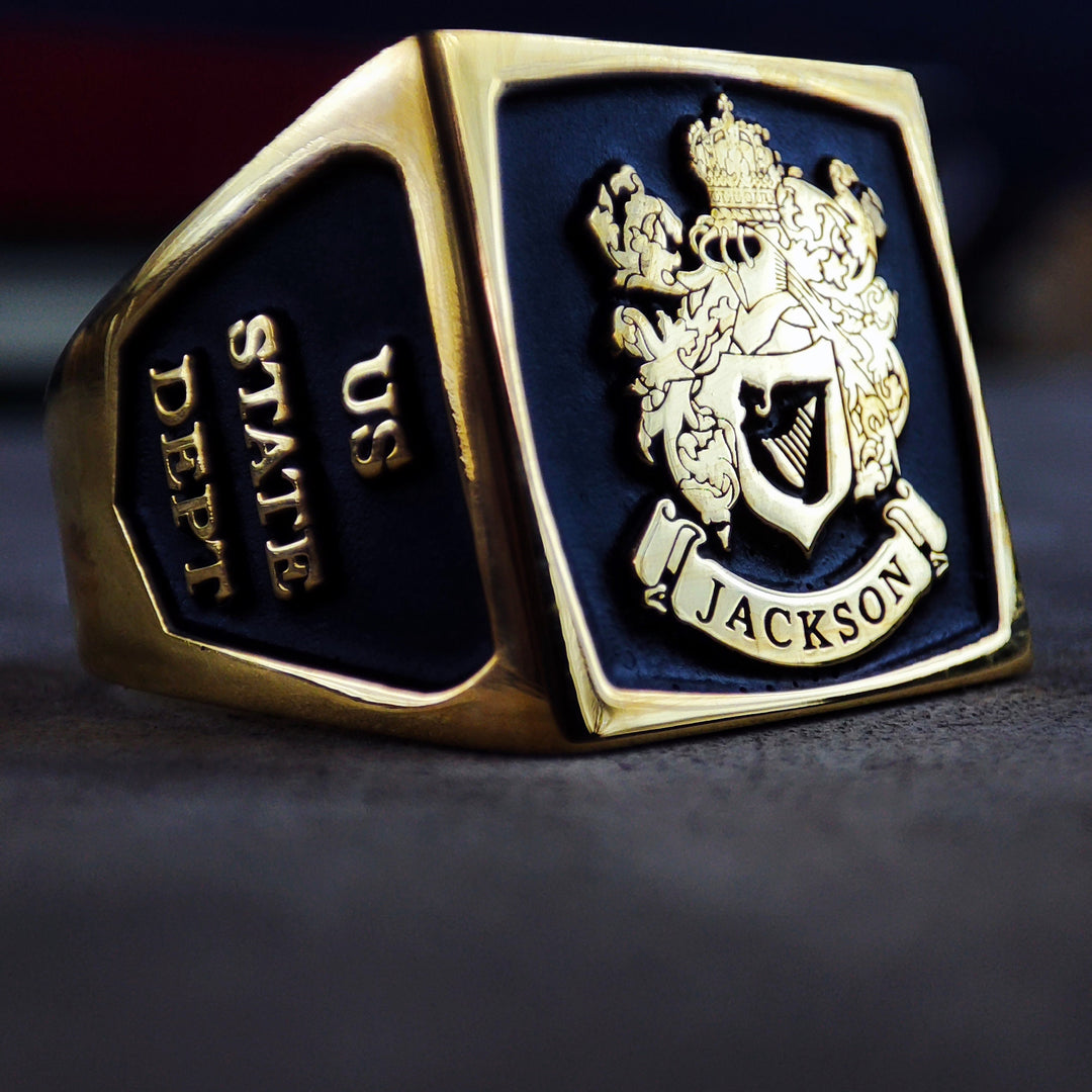 This antique-inspired gold-plated signet ring features an enameled family crest, making it a one-of-a-kind statement piece. Designed for men who appreciate historical elegance and noble heritage, this square ring is a sophisticated representation of tradition. A perfect keepsake or milestone gift, this personalized ring blends craftsmanship with rich family history.