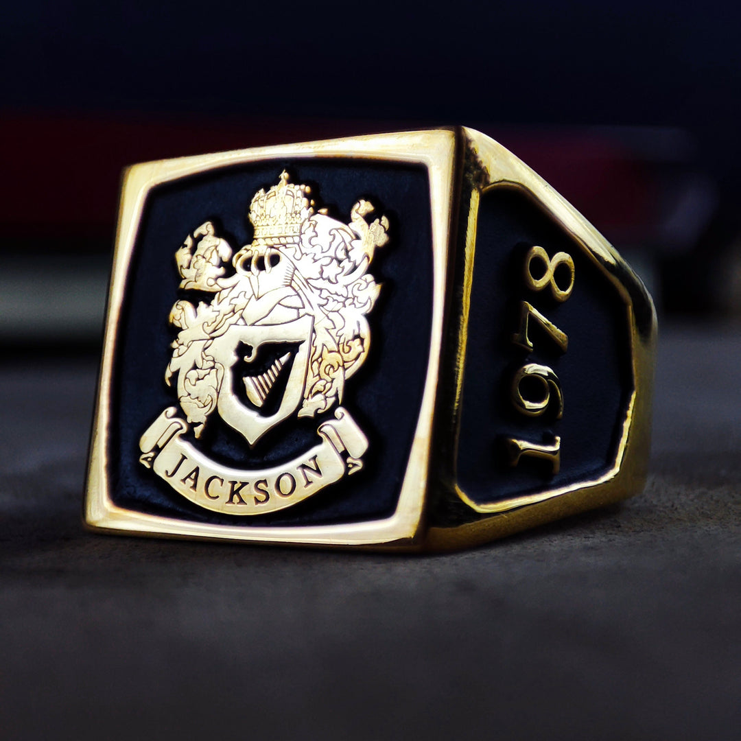 This custom square signet ring features a stunning enamel-filled family crest, highlighting intricate craftsmanship and personal heritage. Designed for men, this gold-plated heirloom ring is a meaningful gift for those celebrating their lineage. Whether worn daily or as a formal accessory, this coat of arms ring symbolizes honor and legacy, making it a truly unique jewelry piece.