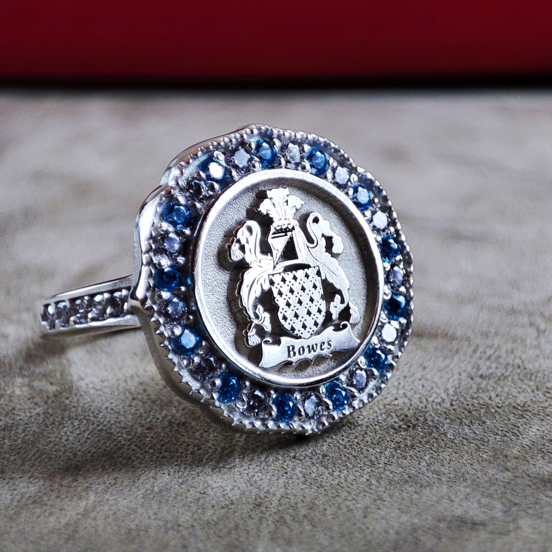 Custom gold family shield ring with a stone, crafted to honor family legacy. This stylish, meaningful ring is a great keepsake for women who cherish their heritage.