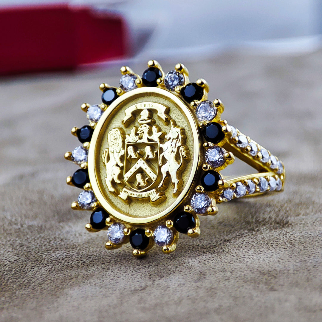 Custom family crest ring for women, featuring a detailed coat of arms engraving in gold. This unique ring represents heritage, perfect for honoring family ties and celebrating ancestry.
