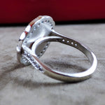 Load image into Gallery viewer, Silver family crest ring with a set stone, crafted for women. This heirloom-quality piece celebrates lineage and makes a thoughtful gift for those who value tradition.