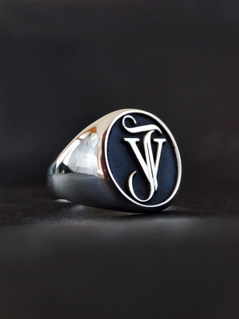 This personalized monogram ring features a unique combination of name and surname initials, crafted with precision and elegance. The engraved design creates a meaningful connection, making it perfect for couples, friends, or as a special treat for yourself. Ideal for daily wear or gifting, this custom initial ring blends timeless charm with a modern twist in fine craftsmanship.