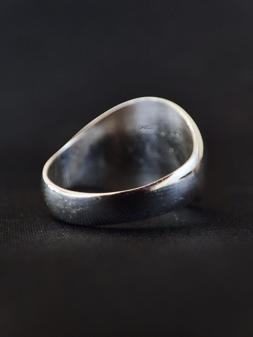 A sophisticated engraved ring that merges your chosen initials into a sleek monogram. Whether it’s your name and surname or a pair of meaningful letters, this piece symbolizes personal identity. Designed for both men and women, it serves as a thoughtful gift or a lasting token of love, connection, or self-expression through custom jewelry.