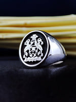 Load image into Gallery viewer, This custom heraldic signet ring is an elegant and meaningful tribute to family history. Crafted in sterling silver and engraved with a personalized coat of arms, this noble crest ring is perfect for history lovers and those who cherish their ancestry. A sophisticated heirloom piece that will be treasured for generations.
