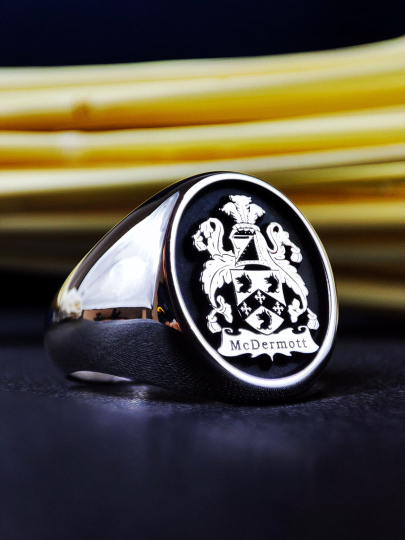 This custom family crest ring in sterling silver is a powerful representation of ancestry and tradition. Featuring a precisely engraved coat of arms, this heraldic signet is perfect for those who appreciate historical jewelry. A distinguished and meaningful heirloom, ideal for passing down through generations as a legacy piece.