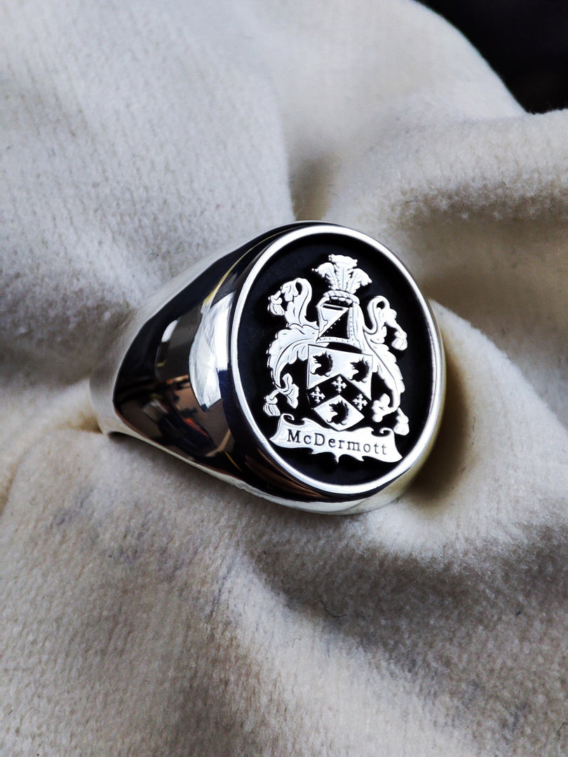A refined and noble silver signet ring, custom-engraved with a detailed coat of arms. This heraldic crest ring is a perfect way to celebrate family history, making it an elegant heirloom piece. Whether for personal wear or as a thoughtful gift, this coat of arms ring represents strength, honor, and noble heritage in a timeless jewelry design.