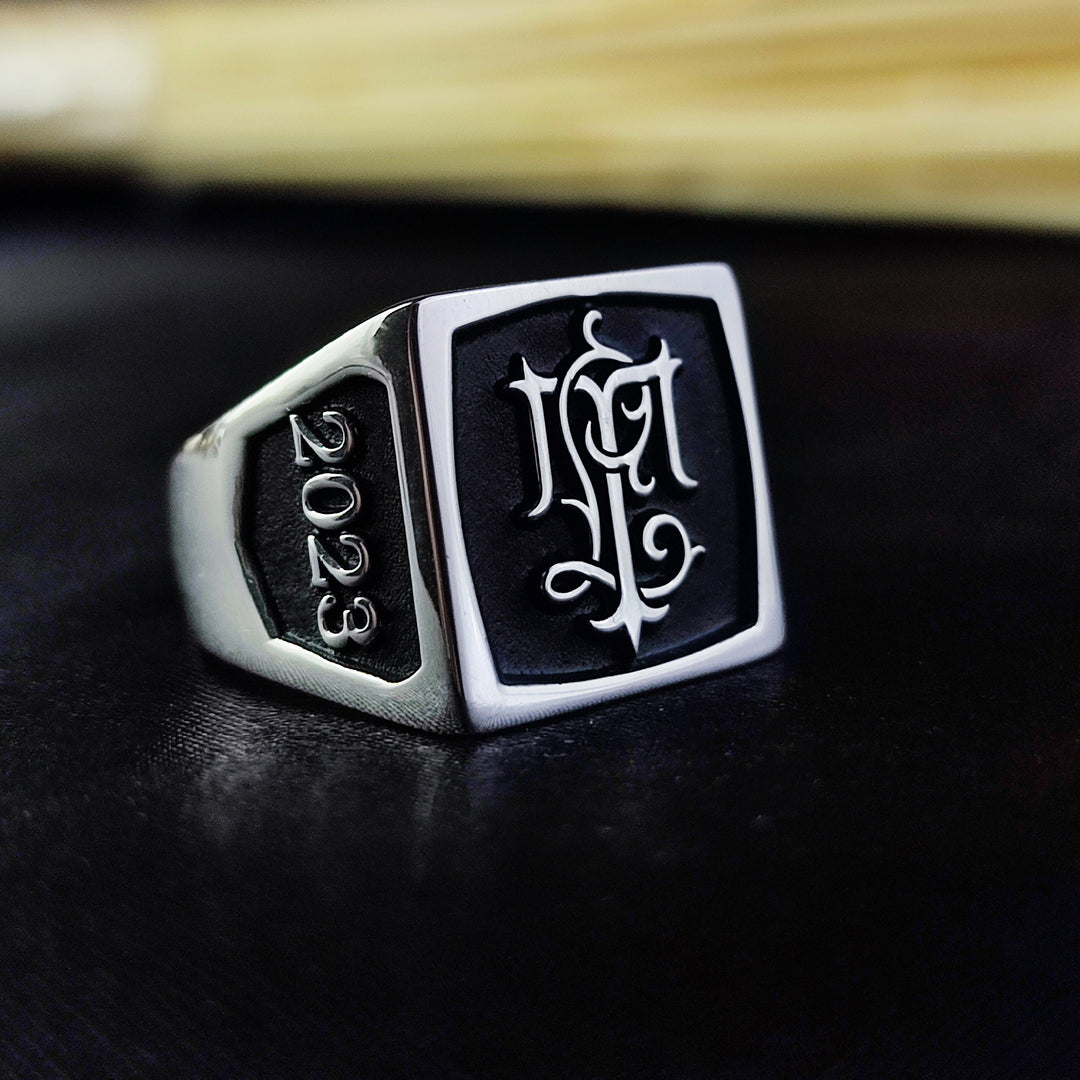This personalized silver monogram ring is designed for those who appreciate custom jewelry with a meaningful touch. Featuring a square signet face with deeply engraved initials, this ring is an excellent way to carry personal identity in a stylish and sophisticated manner. Whether gifted for a loved one or as a personal statement, this elegant and modern piece is a timeless addition to any jewelry collection.
