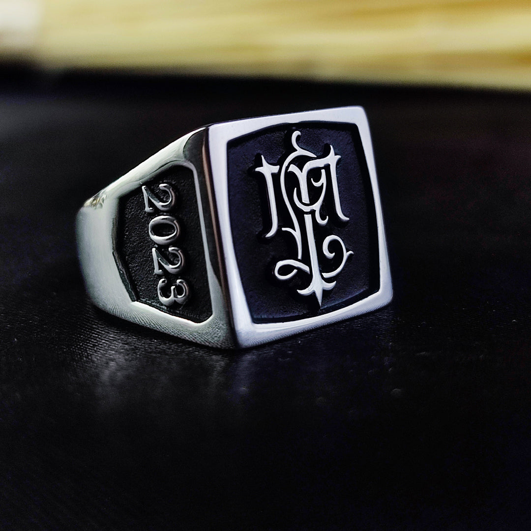 Elevate your style with this personalized silver monogram ring, a beautifully crafted signet piece with a deep initial engraving. This square-shaped custom letter ring is the perfect blend of modern and vintage aesthetics, making it a versatile jewelry item. Whether worn as a daily accessory or a symbolic family heirloom, this ring captures timeless sophistication.