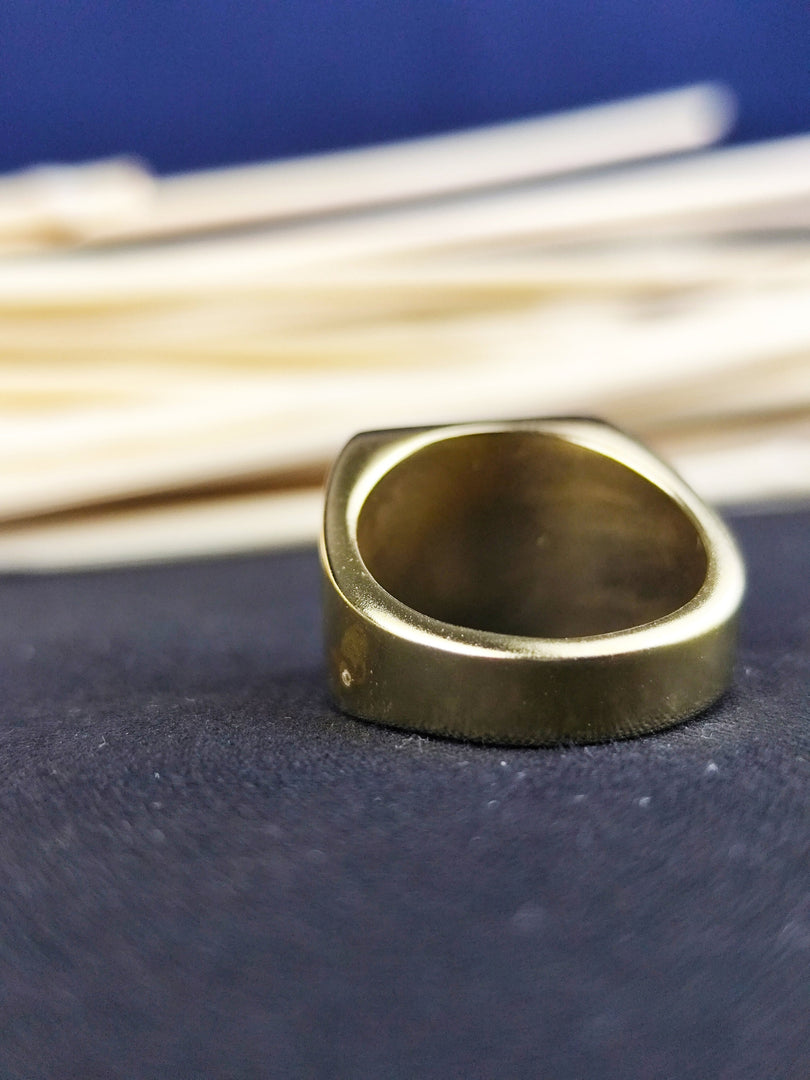 Timeless square signet ring for men, crafted as a university graduation keepsake. Available in gold or silver finishes.