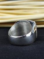 Load image into Gallery viewer, Silver men’s name ring with a central stone and monogram engraving. A timeless piece that celebrates individuality and personal style.