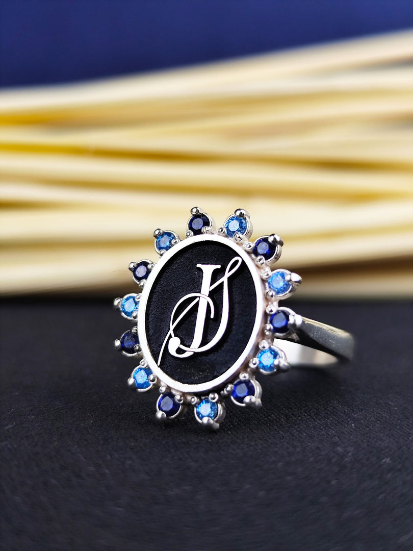 Personalized initial ring for women, set with a stone for added elegance. Available in gold, this monogram ring makes a meaningful and stylish gift.