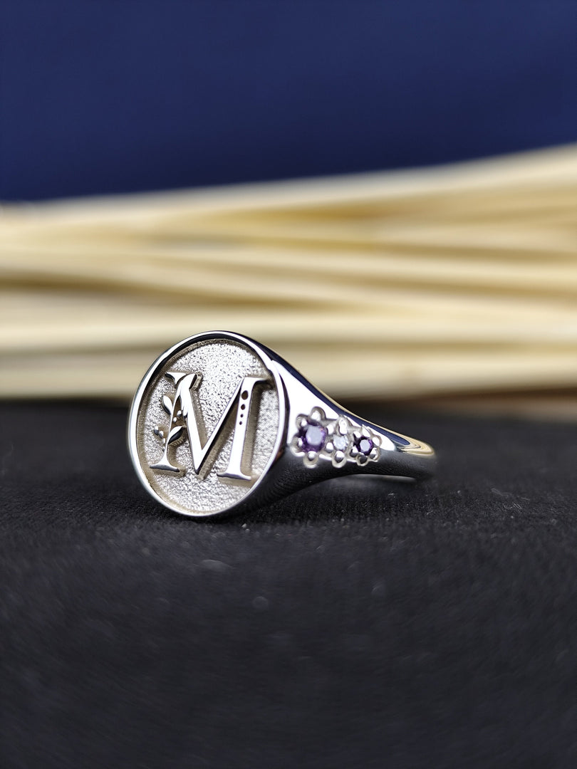 Gold initial ring featuring a single custom letter, combining elegance with a personal touch. A thoughtful gift for any occasion, this ring adds subtle sophistication to any outfit.