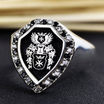 Load image into Gallery viewer, Personalized family crest ring, featuring a custom coat of arms engraving. Available in gold or silver, this ring represents family heritage, making it a meaningful heirloom or unique gift.