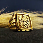 Load image into Gallery viewer, This luxurious gold-plated square signet ring is engraved with a custom family crest, making it a meaningful jewelry piece for men. Whether worn as a daily statement or reserved for special occasions, this coat of arms ring reflects strength, history, and personal pride. An elegant and durable piece, perfect as an heirloom gift or a regal addition to a classic jewelry collection.