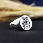 Load image into Gallery viewer, Celebrate your family heritage with this custom round signet ring, featuring a recessed engraving of a family emblem. Crafted with precision, this noble crest ring is an elegant and symbolic jewelry piece for men. A perfect choice for those who appreciate personalized accessories with historical significance, making it an ideal gift for fathers, husbands, or collectors.