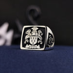 Load image into Gallery viewer, This square heraldic family crest ring is crafted in high-quality silver and enhanced with black enamel detailing. Featuring a custom engraved coat of arms, this signet ring is a bold symbol of heritage and nobility. Designed for those who appreciate history and elegance, it is a perfect heirloom piece, ideal as a meaningful gift for special occasions or personal legacy preservation.