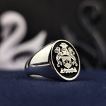 Load image into Gallery viewer, Personalized men’s family crest ring in silver, showcasing a detailed coat of arms. Ideal for honoring ancestry, this ring makes a meaningful and stylish heirloom.