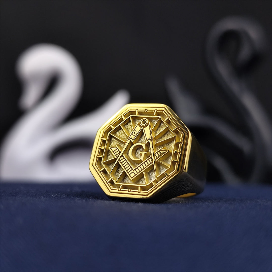6 A distinctive and symbolic Freemason ring, crafted in gold-plated silver with an octagonal shape to enhance its regal appeal. Engraved with the Masonic square and compass emblem, this signet ring embodies the fraternity’s core principles. A meaningful and elegant accessory for members, making it an ideal piece of Masonic lodge jewelry for any occasion.