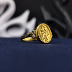 Load image into Gallery viewer, Designed for women of faith, this gold-plated Blessed Mother ring is a tribute to divine love and guidance. The gemstone accent adds elegance, making it a versatile religious accessory for everyday wear. Whether as a personal statement of belief or a thoughtful Catholic gift, this Virgin Mary ring is a treasured keepsake with deep spiritual significance.