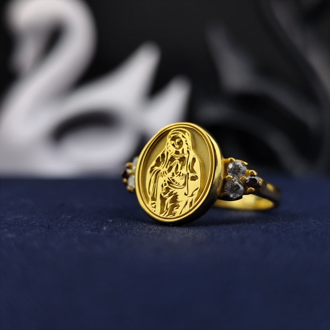Celebrate faith with this exquisite Virgin Mary ring, crafted with gold plating and a stunning gemstone centerpiece. Designed as a meaningful piece of religious jewelry, this ring is perfect for women seeking a symbol of protection and grace. A treasured accessory for daily wear or special occasions, making it an ideal Catholic gift for loved ones.