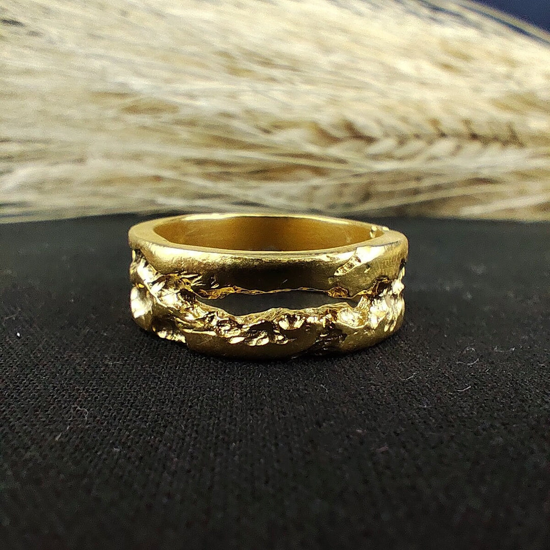 Vintage-inspired rustic gold ring, designed with a textured band. This piece is perfect for those who want a touch of elegance with a rustic twist.