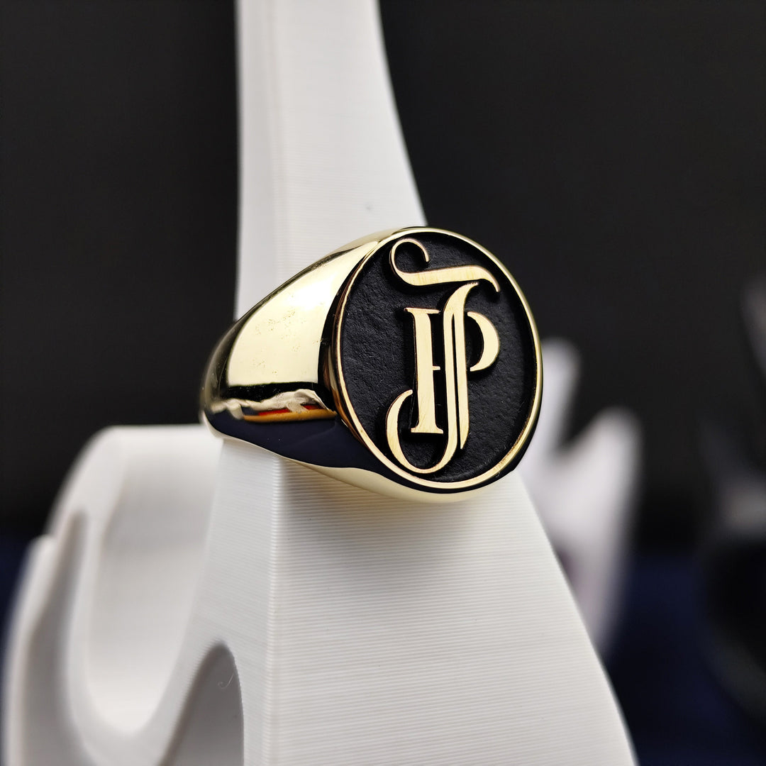 This solid 14K gold monogram ring blends heritage and modern design, featuring engraved initials that represent your name or surname. The rich gold tone and signature craftsmanship make it perfect for collectors, couples, or anyone who values meaningful and timeless accessories made to last a lifetime.