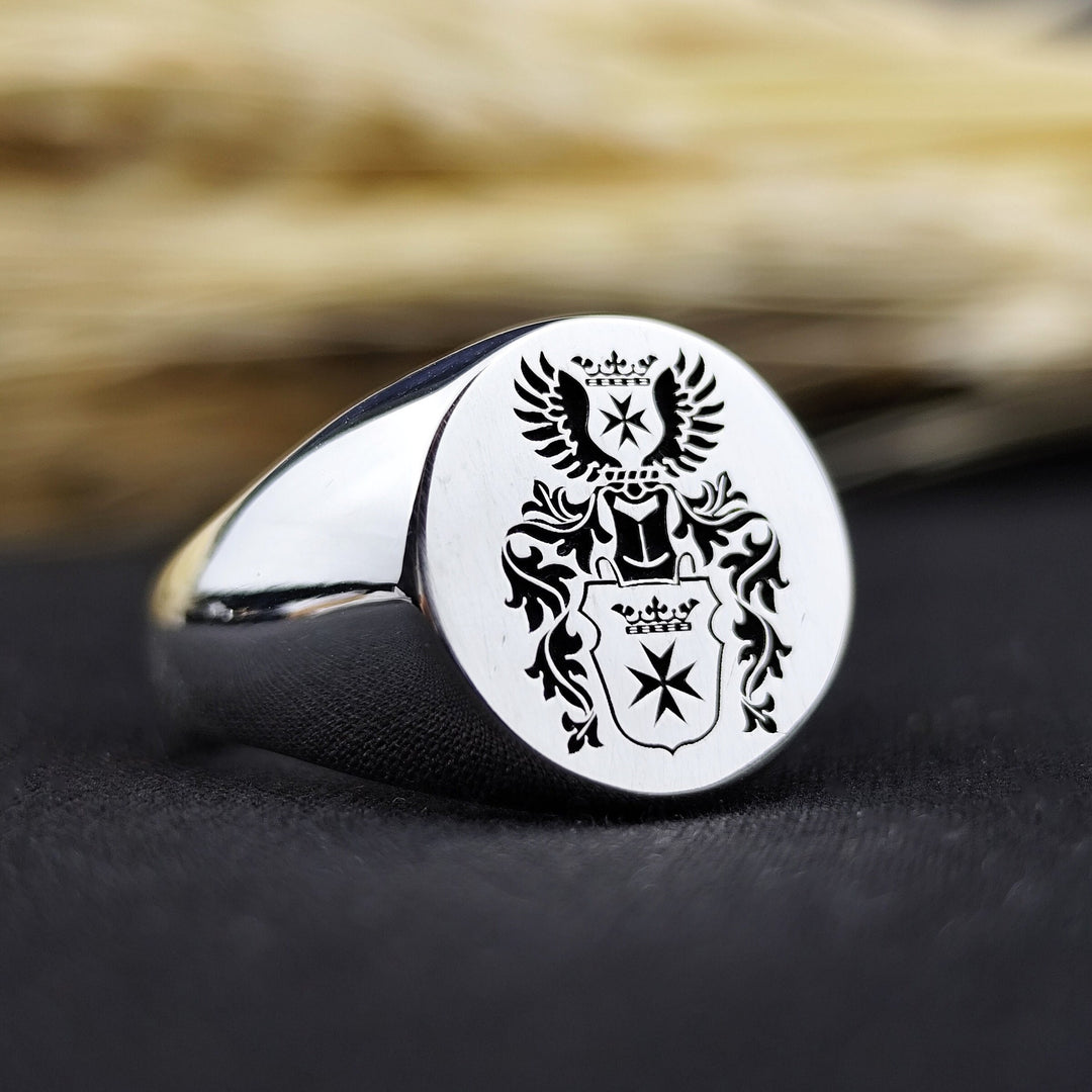 A sophisticated round signet ring featuring a deeply recessed family crest engraving, symbolizing strength and legacy. Designed for men who honor tradition, this personalized ring is perfect as an heirloom piece or a meaningful gift. Crafted with durability and elegance, this coat of arms ring serves as a unique representation of noble heritage, history, and family pride.