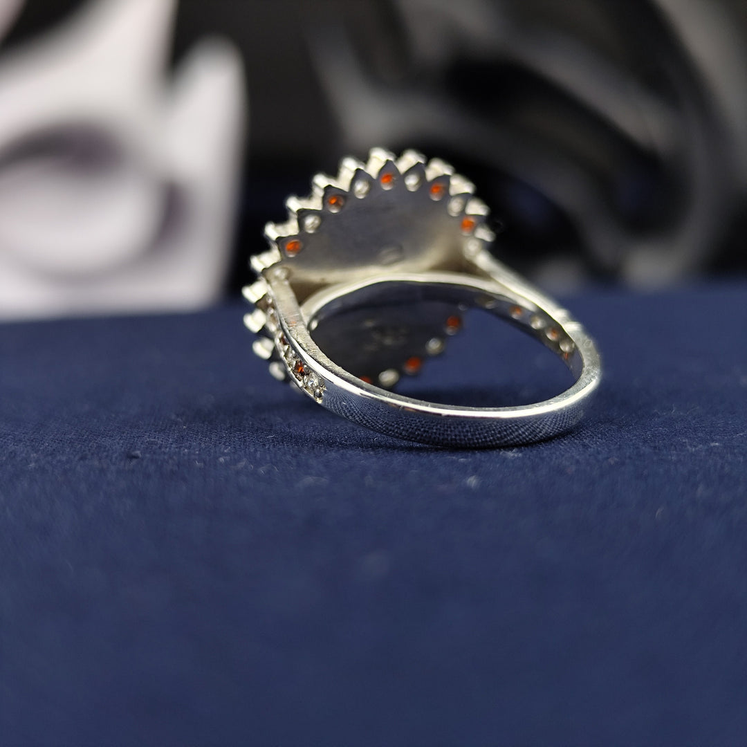 A bold and beautiful monogram ring, crafted in sterling silver and customized with two initials. The combination of a gemstone detail and an enamel finish adds to the luxurious appeal of this signet ring. A timeless and meaningful jewelry piece, perfect for women who love personalized accessories.