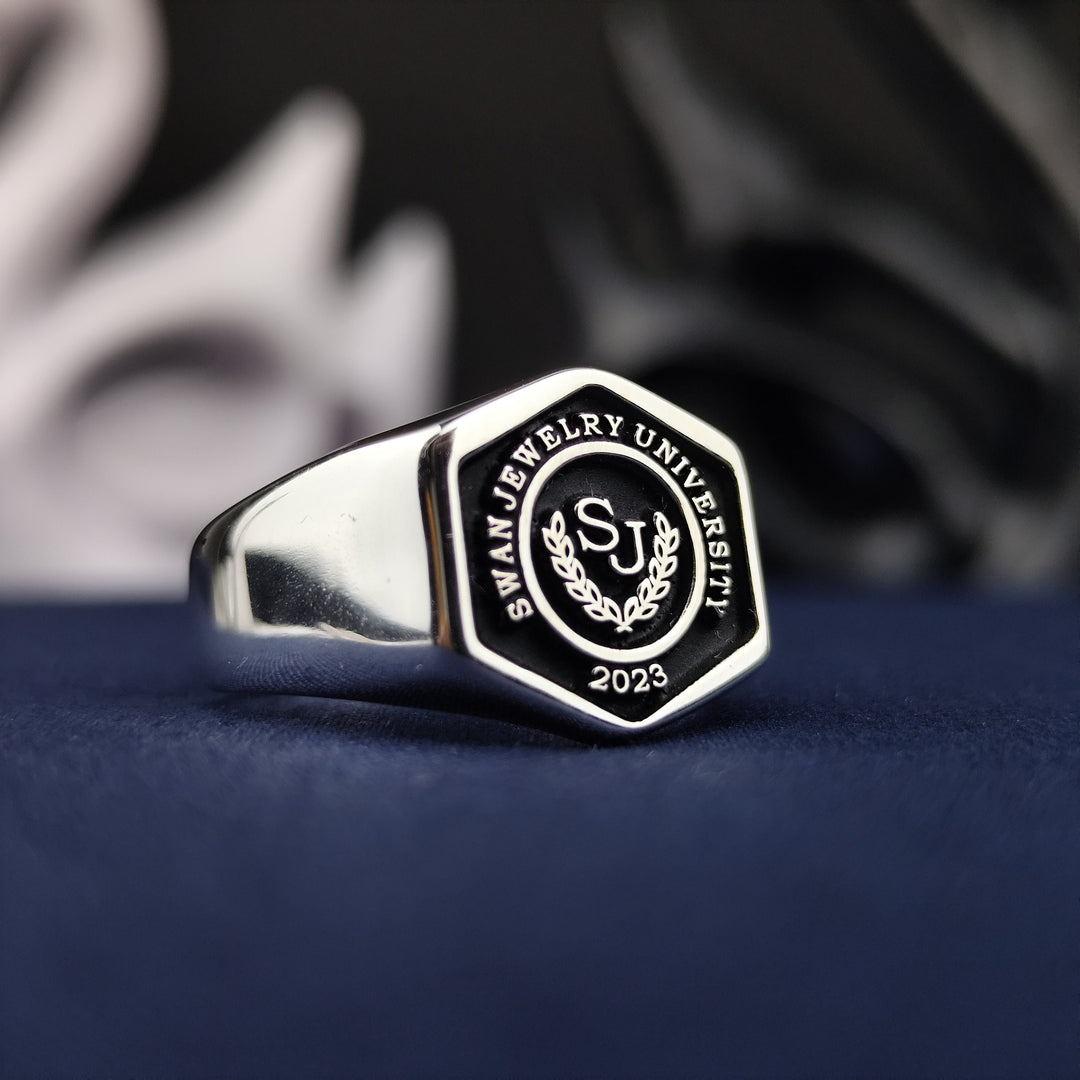 Hexagonal silver university ring, designed for men to celebrate academic achievements. A bold and timeless graduation keepsake.