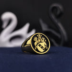 Load image into Gallery viewer, A luxurious round gold-plated signet ring featuring a meticulously engraved family crest, symbolizing honor and tradition. This custom coat of arms ring is a striking heirloom jewelry piece, crafted for those who appreciate fine detailing and historical significance. A unique and refined addition to any collection, perfect for celebrating personal heritage with sophistication.