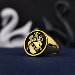 Load image into Gallery viewer, This custom-engraved round heraldic ring is a true masterpiece, blending noble heritage with fine jewelry craftsmanship. The gold-plated finish adds a classic and royal touch, making it an ideal statement piece for those who cherish their lineage. Whether worn daily or reserved for formal occasions, this family crest ring is a tribute to ancestry and tradition.