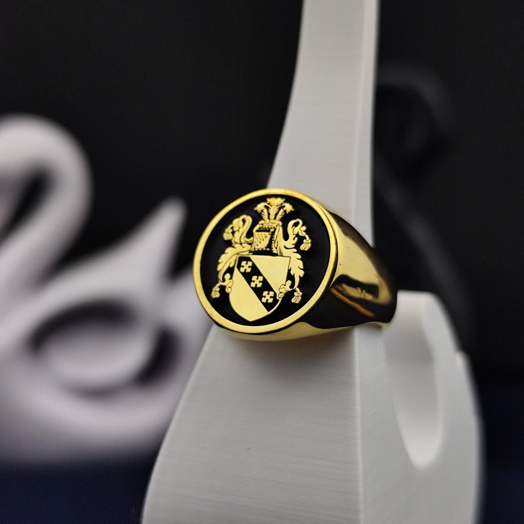 Honor your heritage with this gold-plated round signet ring, engraved with a customized coat of arms. A distinguished and meaningful jewelry piece, it serves as a lasting tribute to family legacy. Whether for daily wear or ceremonial occasions, this family crest ring makes a unique and personal statement, symbolizing strength, history, and tradition in an elegant way.
