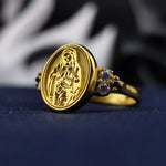 Load image into Gallery viewer, This Virgin Mary gemstone ring is a luxurious faith-inspired accessory for women, featuring intricate gold plating and a radiant gemstone. Whether worn as a spiritual reminder or a statement of devotion, this ring is a timeless piece of Catholic jewelry. A meaningful gift idea for confirmations, baptisms, or any special religious celebration.