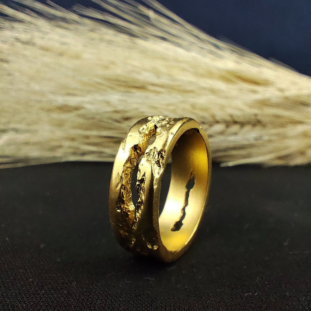 Artisan-crafted gold band with a rustic texture, suitable for men and women. This ring is a beautiful way to showcase a love for unique, handmade jewelry.