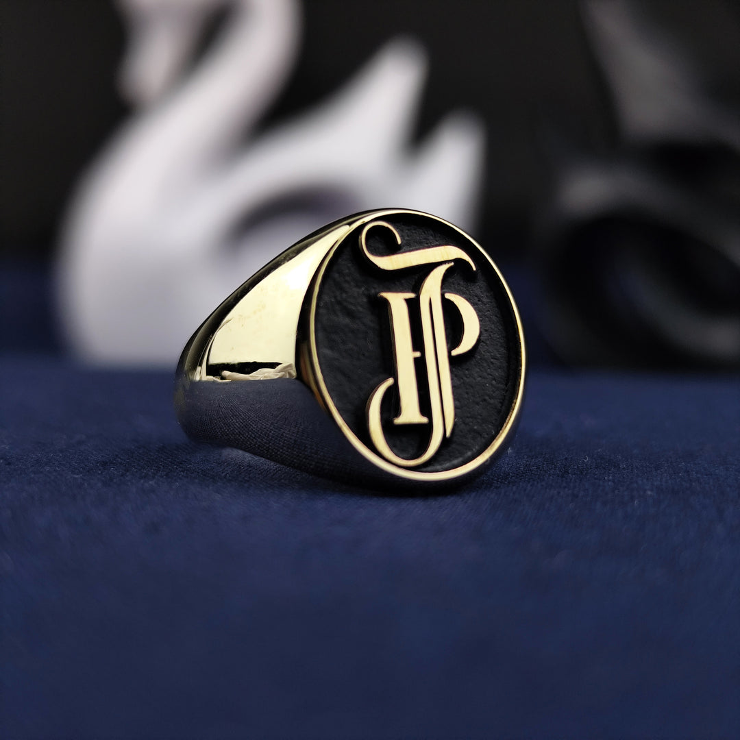 This handcrafted 14K gold ring showcases a refined monogram of name and surname initials in a bold seal design. Perfectly engraved with high attention to detail, it blends traditional craftsmanship with modern luxury. Ideal for gifting or keeping as a meaningful heirloom, this personalized ring is a timeless treasure that reflects identity and elegance.