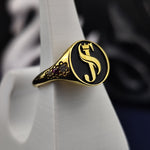 Load image into Gallery viewer, A stunning personalized name ring, crafted in gold plating with a delicate gemstone accent. Designed for women who love elegant and meaningful jewelry, this dainty ring is a perfect combination of sophistication and personalization. Whether worn as a statement of self-expression or gifted to a loved one, this custom engraved ring is a timeless and stylish addition to any jewelry collection.