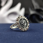 Load image into Gallery viewer, A sophisticated two-letter monogram ring, featuring a sterling silver band with an enamel finish and a delicate gemstone. This personalized name and surname ring is a meaningful way to wear your initials in an elegant and stylish way. A perfect gift for birthdays, anniversaries, or any special occasion.
