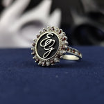 Load image into Gallery viewer, A classic silver initial ring, featuring a two-letter monogram and a gemstone for a refined touch. The enamel detailing enhances the elegance of this custom piece, making it an ideal name or surname ring. A delicate and timeless jewelry item, perfect for stacking or wearing as a standalone statement piece.