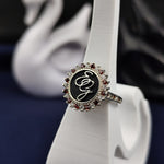 Load image into Gallery viewer, A stylish and modern silver monogram ring for women, featuring two engraved initials with an elegant enamel coating. The gemstone accent adds a luxurious feel to this customizable signet ring. Whether as a family heirloom, surname ring, or personal keepsake, this jewelry piece is designed for timeless elegance.