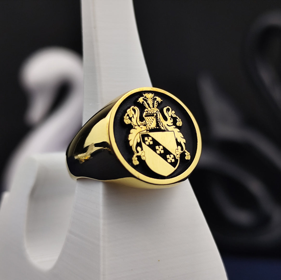 This round gold-plated family crest ring is a symbol of heritage and nobility, featuring a custom-engraved coat of arms. Designed as a sophisticated and meaningful heirloom, this heraldic signet ring blends traditional elegance with modern craftsmanship. A perfect gift for those who cherish family legacy, it makes an excellent addition to any jewelry collection, serving as a refined and stylish statement piece.