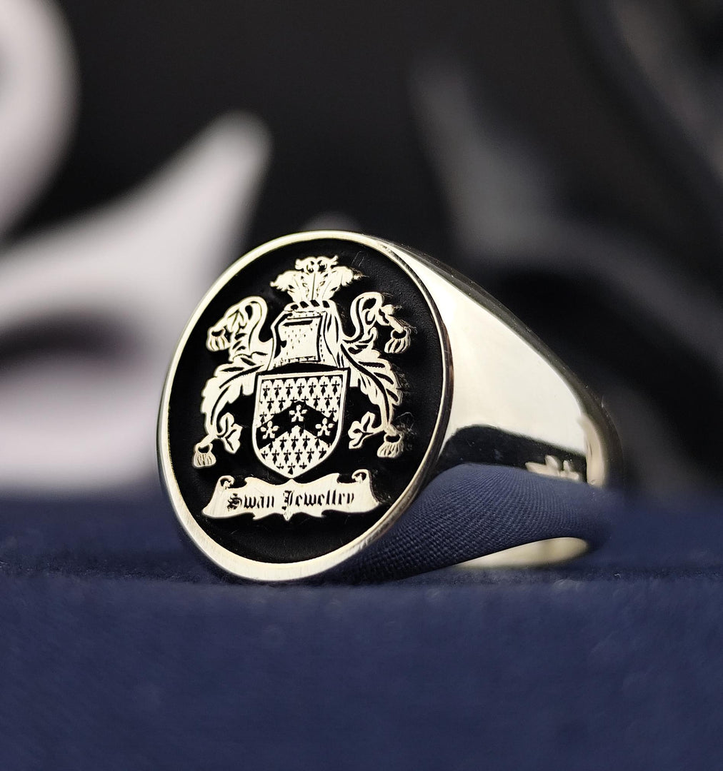 Silver signet ring for men featuring a custom engraved family crest. Perfect for those valuing heritage, this ring combines classic style with personal significance.