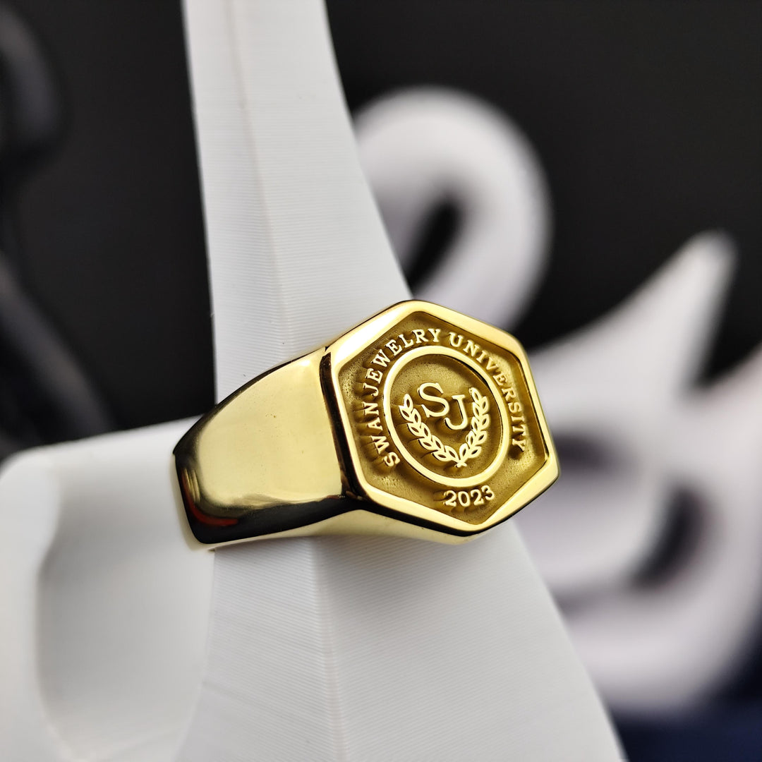 Unique gold-plated hexagonal ring, designed for university graduates. A versatile piece for both formal and casual occasions.