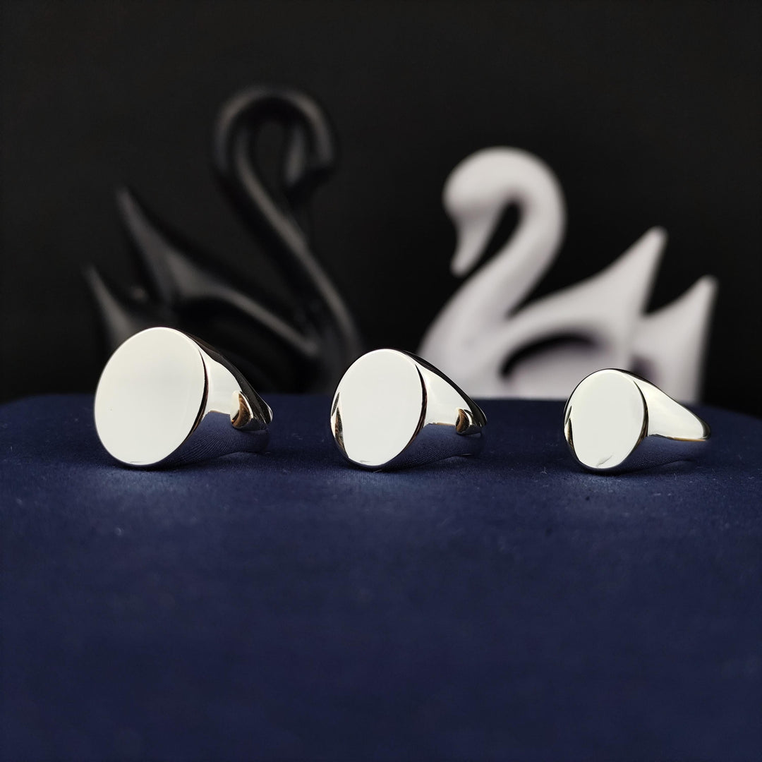 Blank oval silver ring, perfect for custom engraving. This minimalist ring is ideal for creating a personalized signet or unique statement piece.