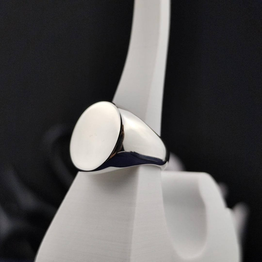 Men’s blank signet ring in silver, featuring an oval shape ready for personalization. A versatile piece perfect for custom designs or initials.