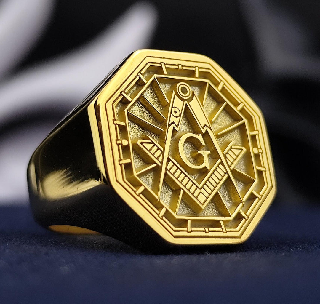 This octagonal gold-plated Masonic ring is a distinguished Freemason jewelry piece, featuring a precisely engraved square and compass emblem. Designed for men who appreciate Masonic heritage, this signet ring symbolizes wisdom, fraternity, and strength. A perfect addition to any Mason’s collection, this ring serves as a timeless representation of brotherhood, making it an ideal gift or personal statement piece.